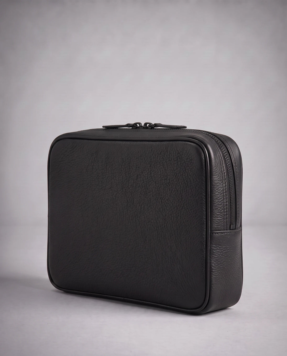 Principal Clutch in black, angled