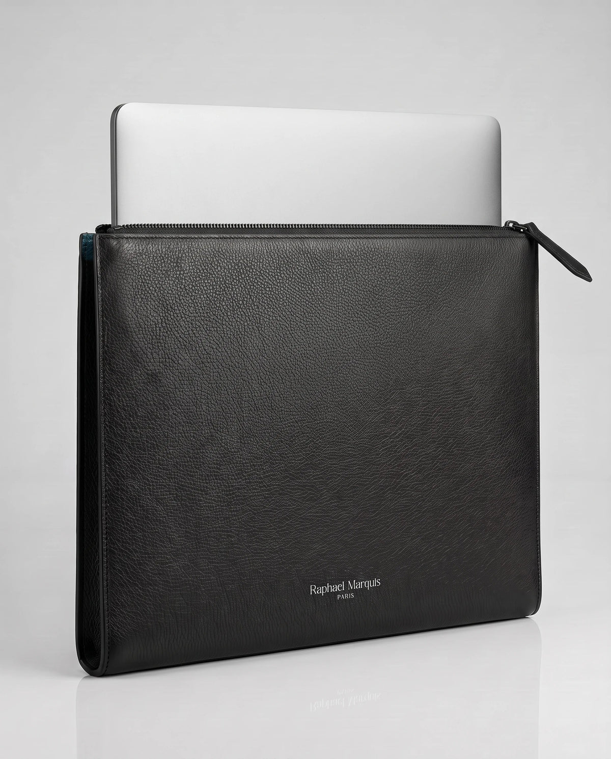Principal Sleeve in black, with laptop