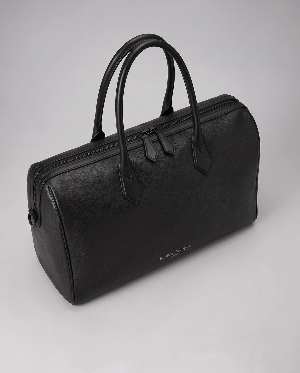 Principal Traveller in black, three-quarter